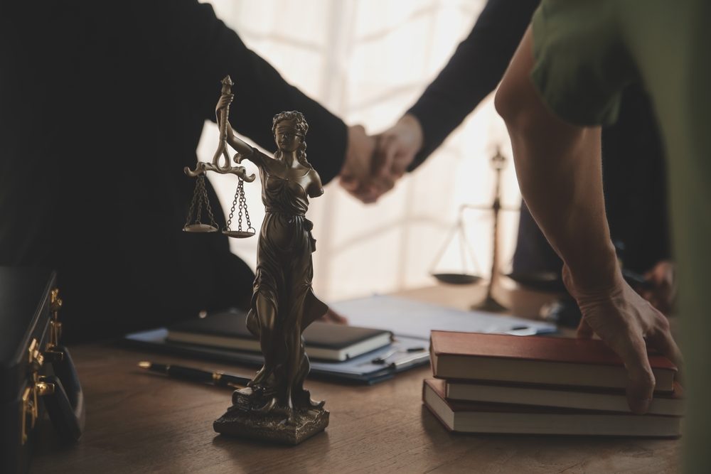 A car accident lawyer meeting with his client. What does a car accident lawyer do?